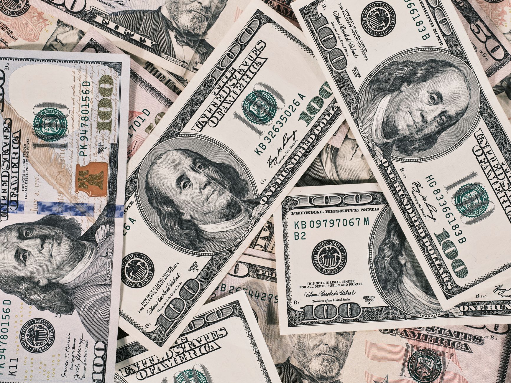 Detailed close-up of US dollar bills highlighting wealth and finance concepts.
